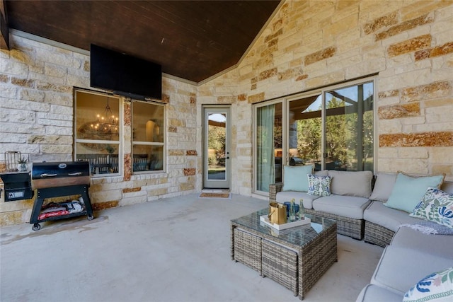 view of patio with grilling area and outdoor lounge area