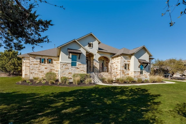 view of front of property with a front lawn and stone siding