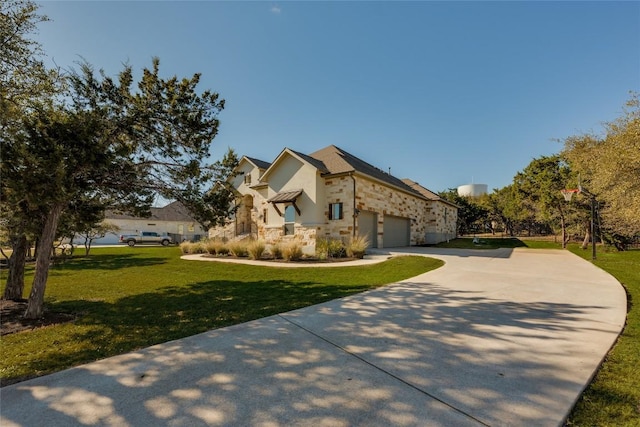 view of front facade with a front lawn, stucco siding, stone siding, and concrete driveway