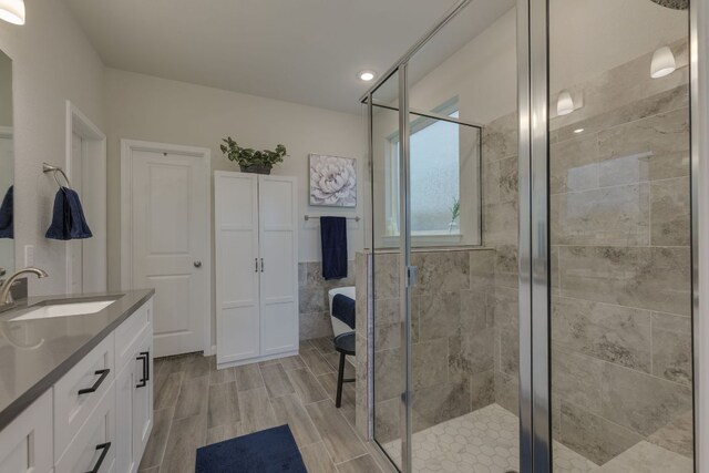 116 Evening Star Ln, Georgetown, TX 78628 - full bath featuring vanity, a shower stall, recessed lighting, and wood finished floors