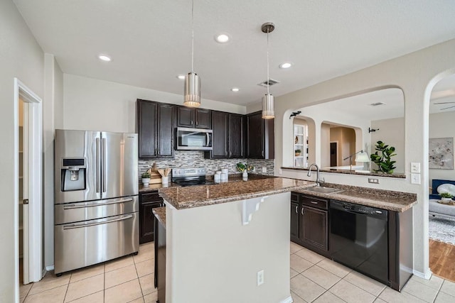 kitchen featuring light tile patterned floors, visible vents, appliances with stainless steel finishes, and a sink