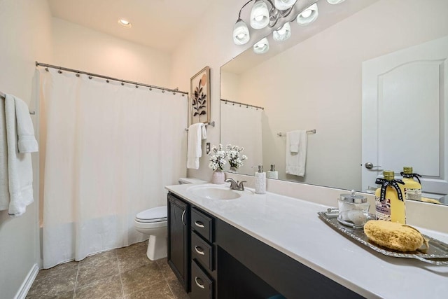 bathroom with curtained shower, vanity, and toilet