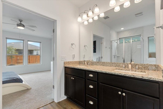 bathroom featuring a sink, plenty of natural light, and visible vents