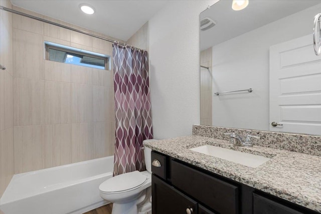 full bath with toilet, visible vents, shower / tub combo with curtain, and vanity