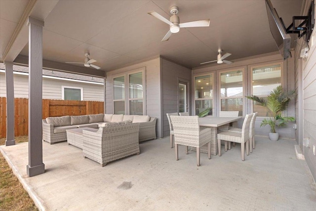 view of patio featuring an outdoor living space, a ceiling fan, fence, and outdoor dining space