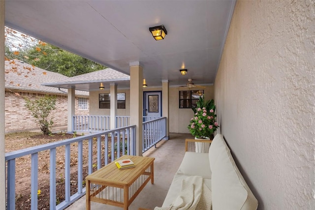 exterior space with a shingled roof, brick siding, a porch, and an outdoor hangout area