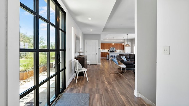 interior space featuring dark wood-style floors, baseboards, and recessed lighting