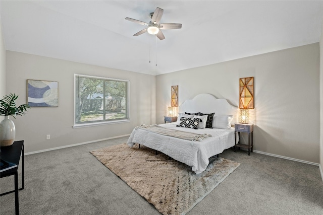 carpeted bedroom with a ceiling fan, vaulted ceiling, and baseboards