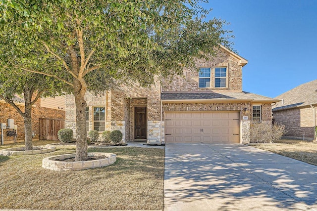 view of front of property with a garage, concrete driveway, stone siding, fence, and brick siding