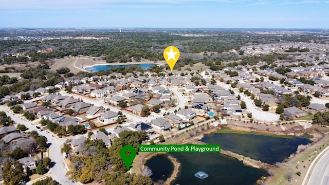 bird's eye view with a water view and a residential view