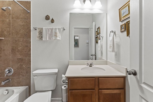 full bath with  shower combination, a textured wall, vanity, and toilet