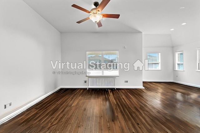 unfurnished living room with a ceiling fan, radiator, wood-type flooring, and baseboards