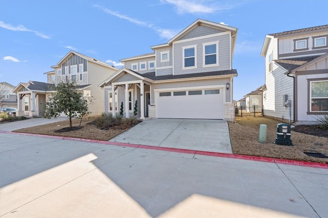 craftsman house featuring driveway, an attached garage, and fence