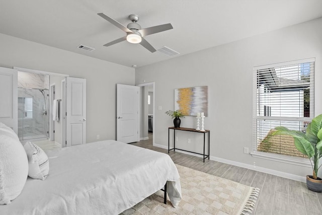 bedroom featuring light wood-style floors, visible vents, baseboards, and a ceiling fan