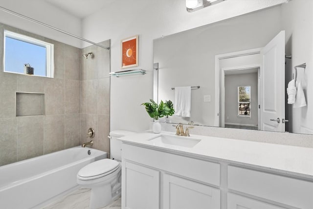 bathroom featuring marble finish floor, shower / bathing tub combination, vanity, and toilet