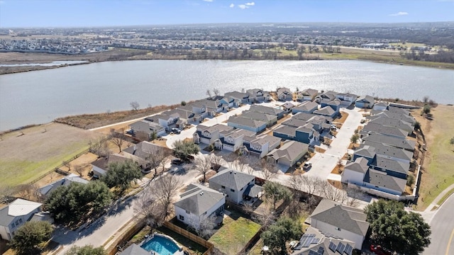 birds eye view of property featuring a water view and a residential view