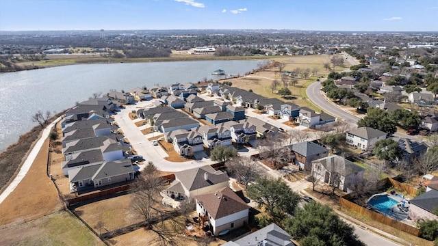 bird's eye view featuring a water view and a residential view