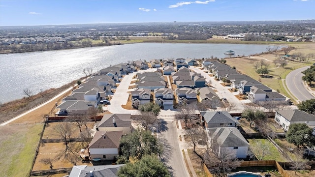 bird's eye view with a water view and a residential view