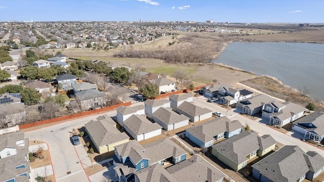 drone / aerial view with a residential view and a water view