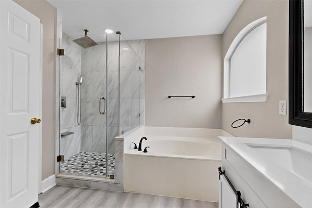 5008 Barlow Dr, Round Rock, TX 78681 - full bath featuring a garden tub, a marble finish shower, vanity, and wood finished floors