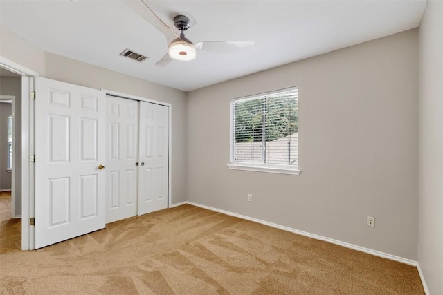 5008 Barlow Dr, Round Rock, TX 78681 - unfurnished bedroom with light colored carpet, a closet, and ceiling fan
