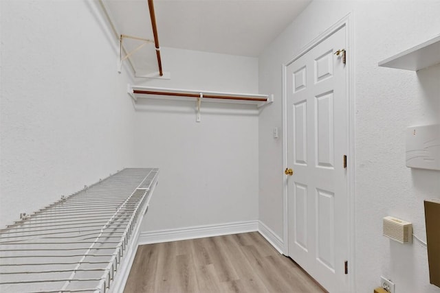 5008 Barlow Dr, Round Rock, TX 78681 - walk in closet with wood finished floors