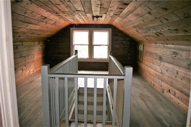 unfinished attic featuring an upstairs landing