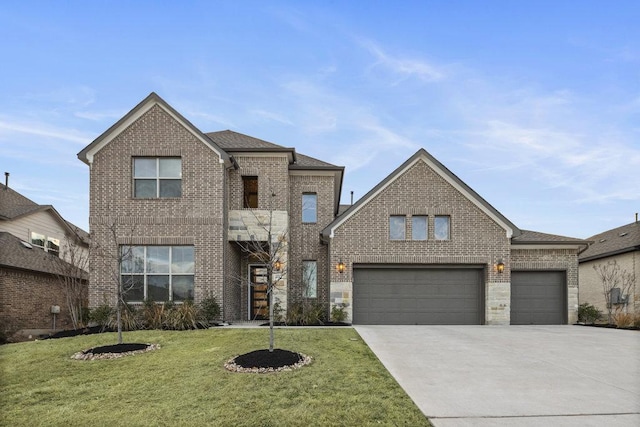 traditional-style house with brick siding, a shingled roof, an attached garage, a front yard, and driveway