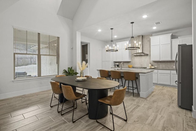 5824 Antelope Well Ln, Austin, TX 78738 - dining area featuring a chandelier and recessed lighting