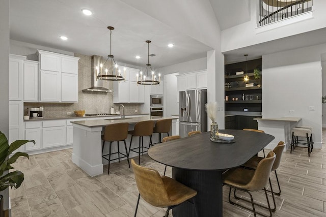5824 Antelope Well Ln, Austin, TX 78738 - dining space featuring a chandelier and recessed lighting