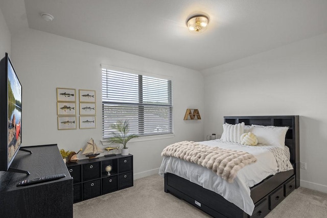 bedroom featuring carpet flooring and baseboards