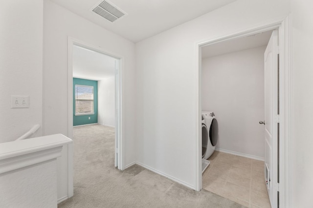 213 Lemon Light Ln, Pflugerville, TX 78660 - laundry room featuring washing machine and clothes dryer, baseboards, and light colored carpet