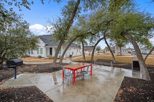 305 Bolivar Way Unit 101, San Marcos, TX 78666 - view of patio featuring area for grilling and a residential view