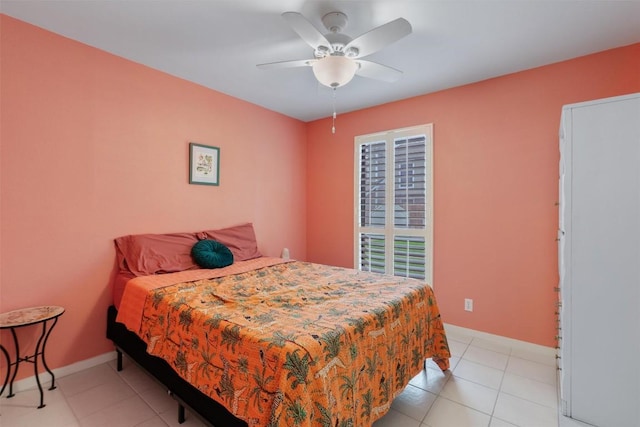 bedroom featuring light tile patterned flooring, ceiling fan, and baseboards