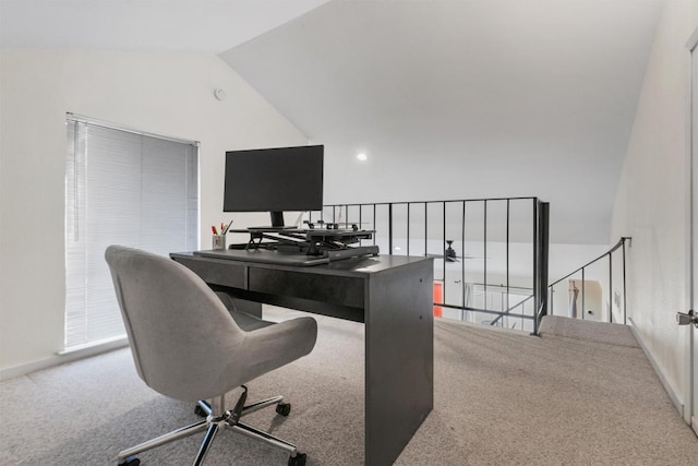 home office featuring lofted ceiling, carpet flooring, and baseboards