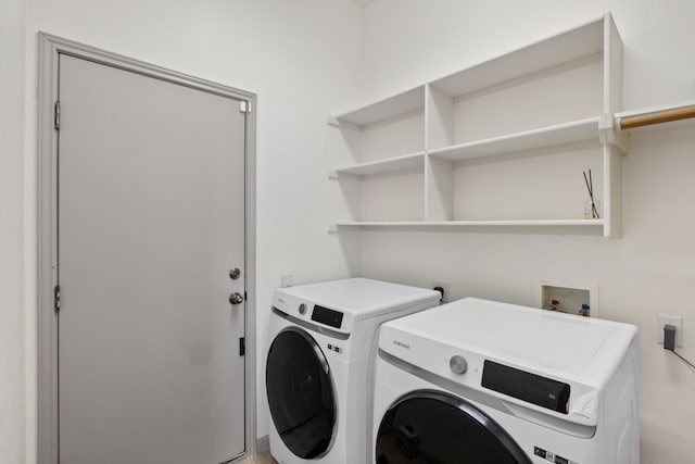 washroom with laundry area and washing machine and clothes dryer