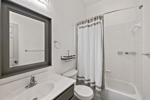 bathroom featuring shower / bath combination with curtain, vanity, and toilet