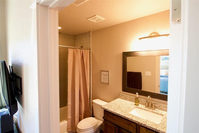 bathroom featuring visible vents, a textured wall, toilet, shower / bath combination with curtain, and vanity