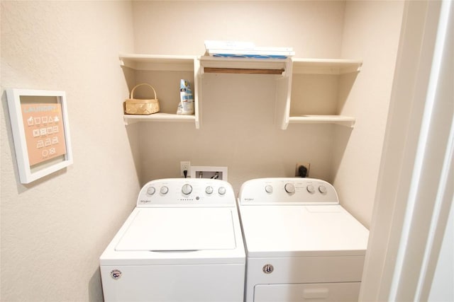 clothes washing area with separate washer and dryer