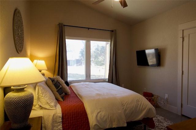 bedroom with vaulted ceiling and a ceiling fan