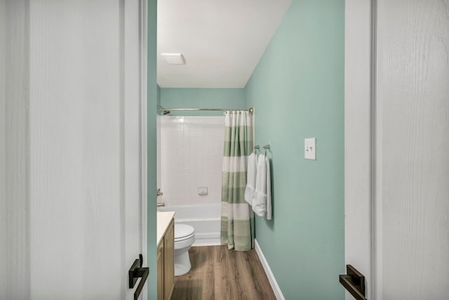 15401 Montoya Cv, Austin, TX 78717 - bathroom with wood finished floors, toilet, shower / tub combo, vanity, and baseboards