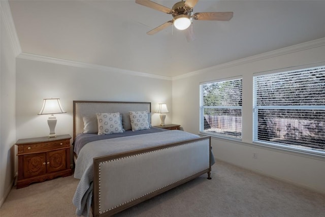 bedroom with carpet floors, ceiling fan, baseboards, and crown molding