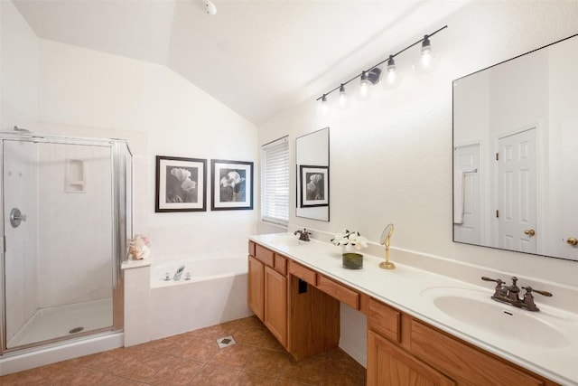 full bathroom featuring vaulted ceiling, tile patterned flooring, a sink, and a shower stall