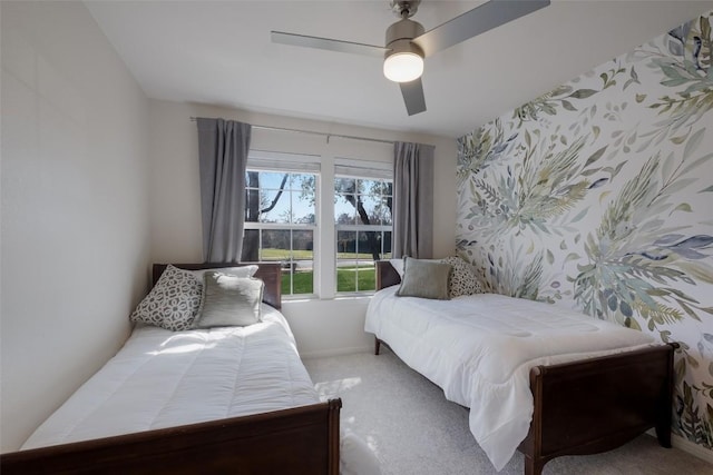 bedroom with ceiling fan, carpet, baseboards, and wallpapered walls