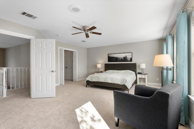 bedroom featuring light carpet, baseboards, visible vents, and ceiling fan