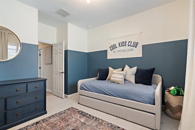 bedroom featuring light colored carpet, visible vents, and baseboards