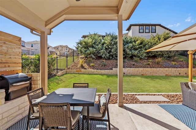 view of patio / terrace with outdoor dining space, a fenced backyard, and a grill