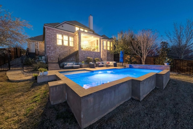 view of pool with a fenced in pool, a fenced backyard, a yard, and an outdoor living space