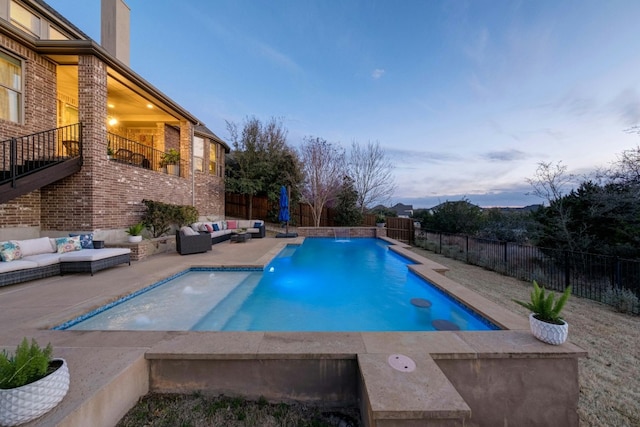 view of swimming pool with a patio, outdoor lounge area, a fenced backyard, and a fenced in pool