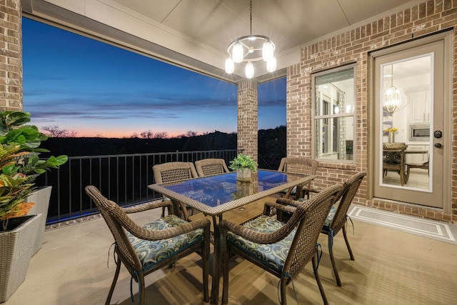 patio terrace at dusk with outdoor dining space